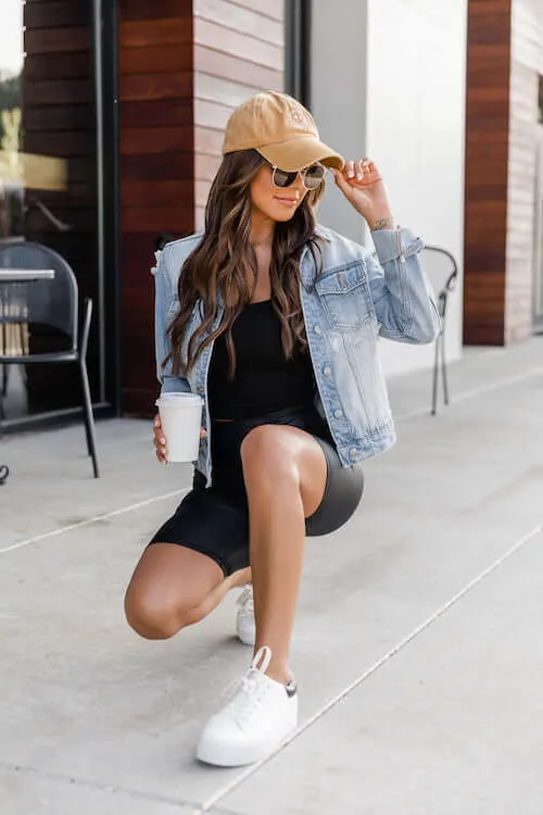 denim jacket outfit with black biker shorts