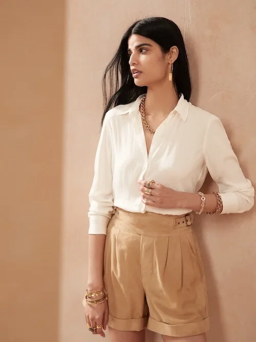 woman wearing linen shirt and khaki shorts