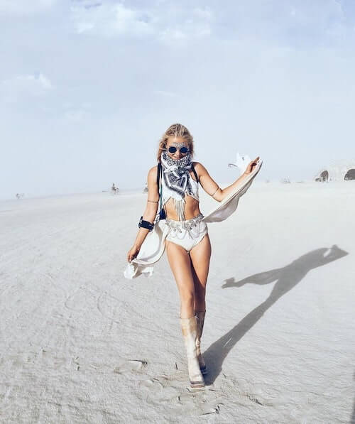 a woman wearing sexy and stylish desert festival clothing