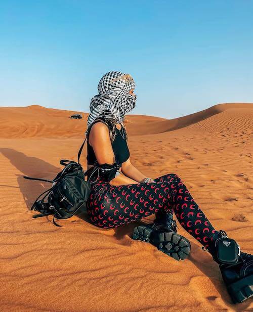 woman wearing stylish leggings and desert boots