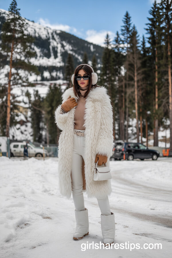 Long White Faux Fur Coat with Skinny Pants and Winter Boots