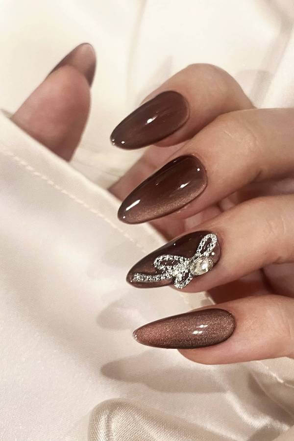 Brown Cat Eye Nails with Bow Accent