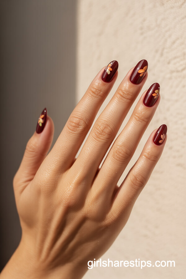 Burgundy floral almond nails