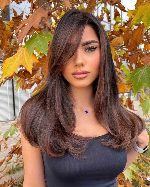 Long Straight Layers with Curtain Bangs