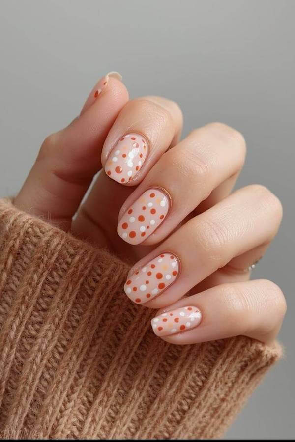 Nude Nails with Orange and White Dots