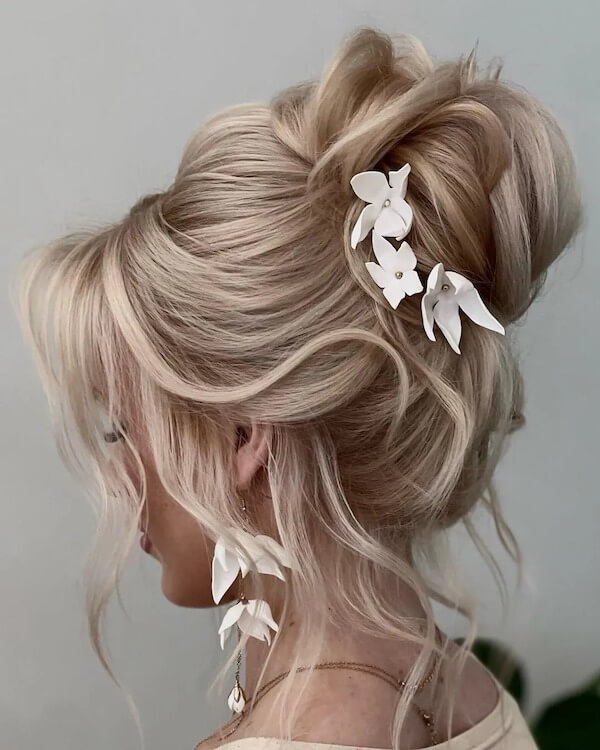 Voluminous Updo with Floral Accents