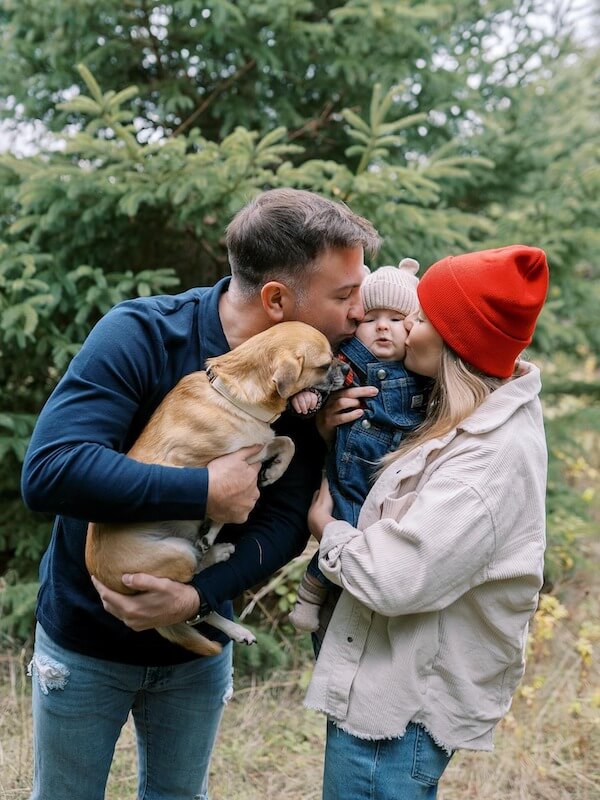 Cozy Family Kiss with Pet