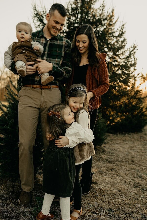 Warm Sibling Hug Christmas Photo