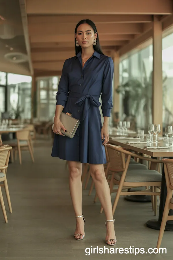 Navy Shirt Dress with Statement Accessories
Pair a crisp navy shirt dress with bold gold jewelry, such as oversized hoop earrings or a chunky chain necklace. Add a structured leather handbag in tan or red for contrast, and finish with pointed-toe ankle boots or sleek loafers. A wide-brimmed hat or a silk scarf tied around the neck elevates the look for polished sophistication.