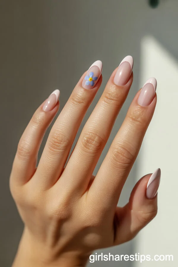 Sheer Pink French Tips with Blue Forget-Me-Not Nail Art