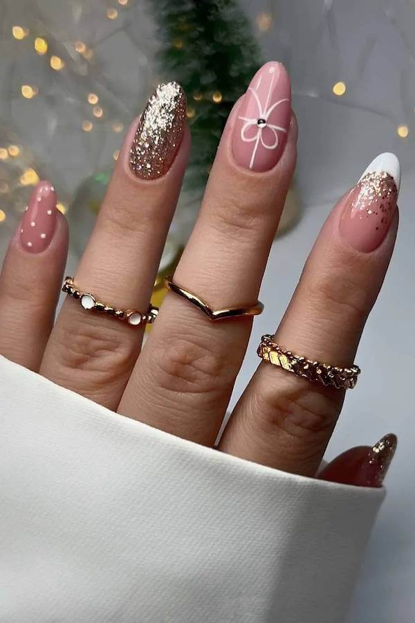 Festive Gold And Pink Christmas Nails