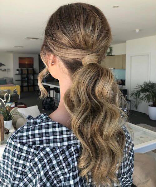 Textured Low Ponytails graduation hairstyles for long hair