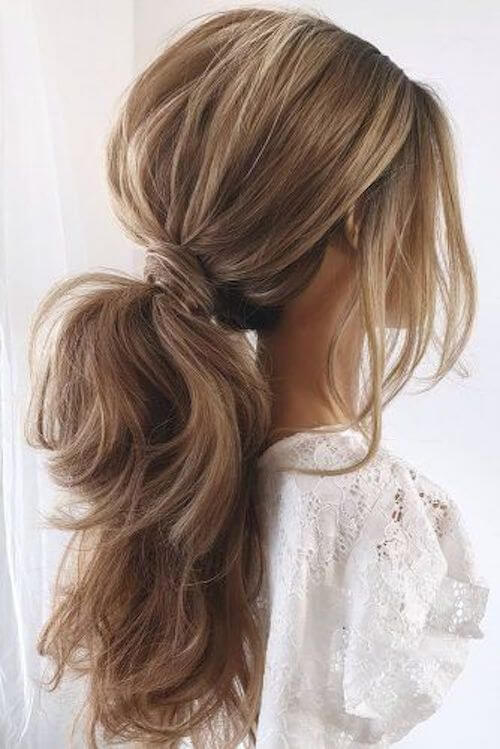 Textured Low Ponytails graduation hairstyles for long hair