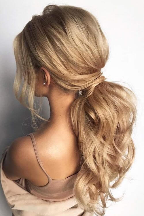Textured Low Ponytails graduation hairstyles for long hair