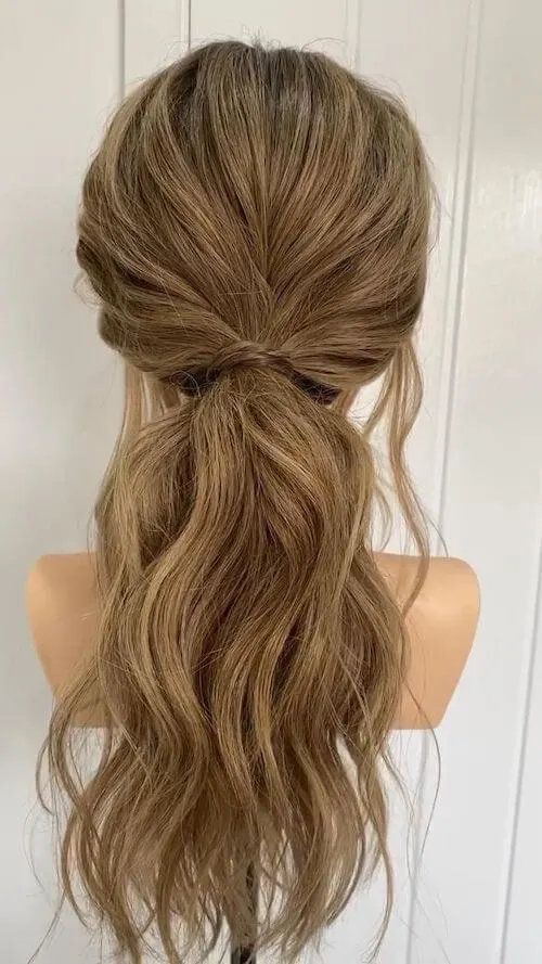 Textured Low Ponytails graduation hairstyles for long hair