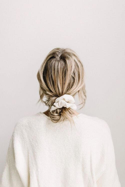 Messy Low Bun graduation hairstyles for long hair
