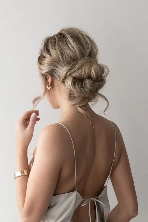 Messy Low Bun graduation hairstyles for long hair