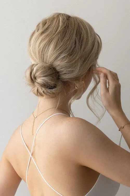 Messy Low Bun graduation hairstyles for long hair