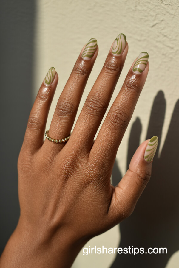 Moss green swirl designs on nude base
