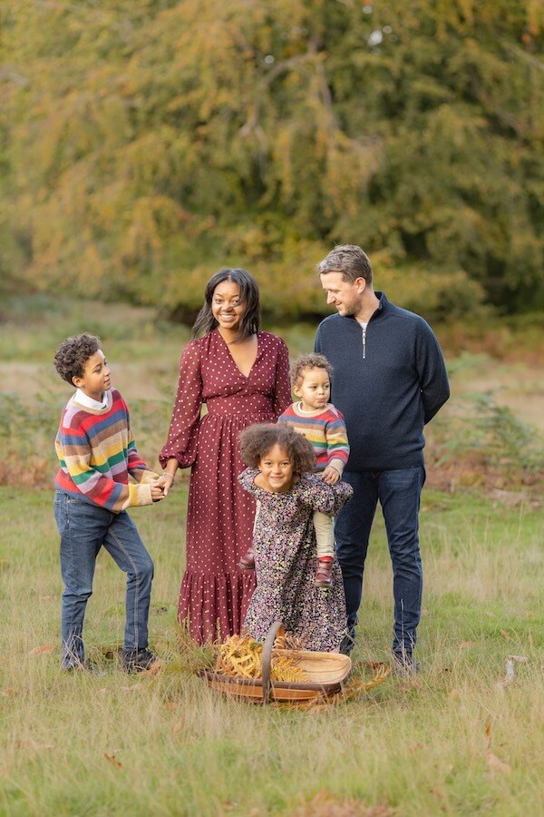 Colorful Sweaters and Patterned Dresses Family Outfits