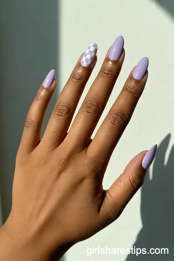 Almond Light Purple Nails with Checkerboard Accent Design