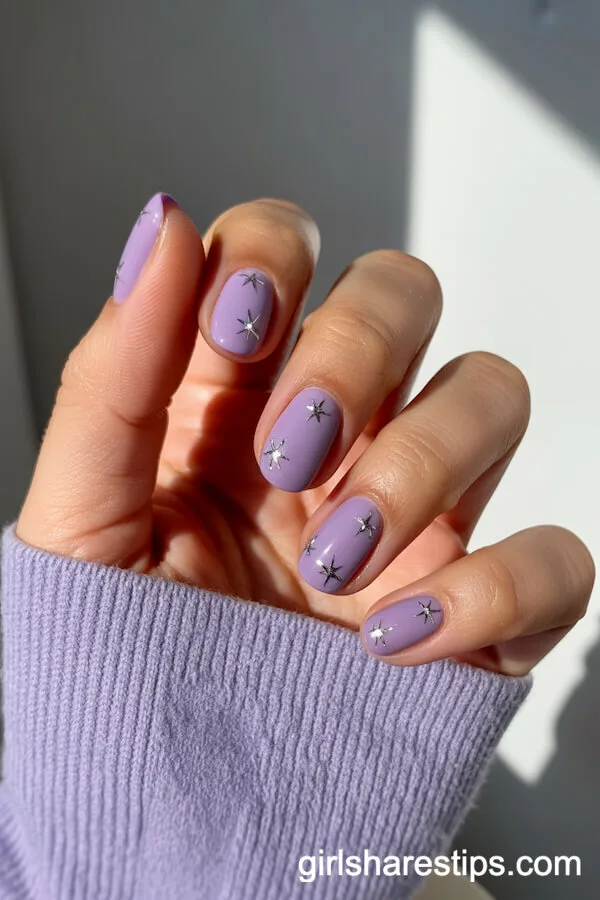 Rounded Glossy Lavender Nails with Silver Star Accents