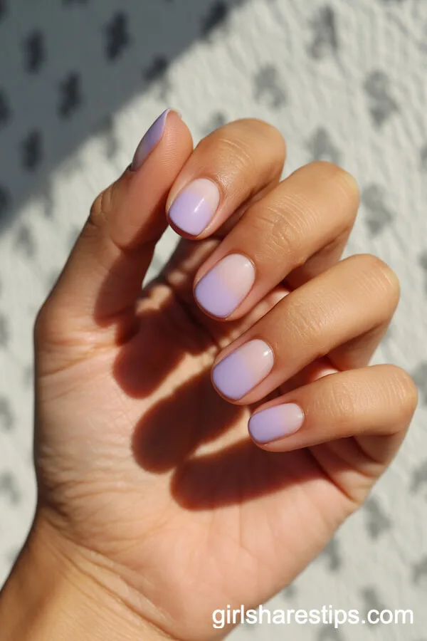 Rounded Ombre Nails Blending Light Purple and Pale Pink