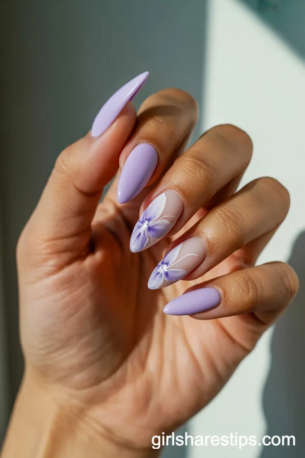 Stiletto Light Purple Nails with White Floral Accents