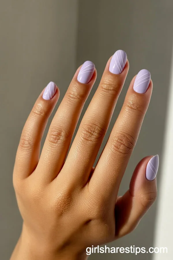 Short Rounded Nails with Light Purple and White Geometric Lines