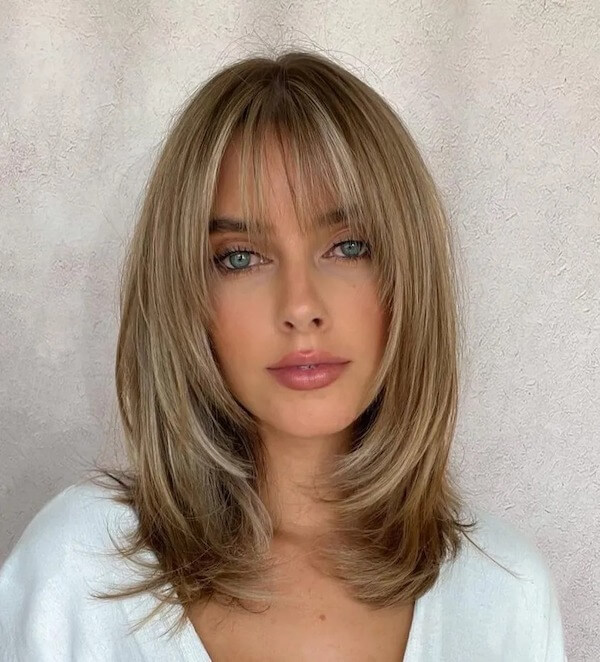 Straight Layered Hair with Curtain Bangs