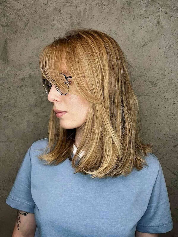 Blonde Medium Straight Hair with Soft Wispy Bangs