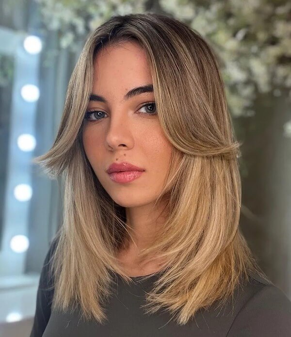 Layered Medium Straight Hair with Face-Framing Curtain Bangs
