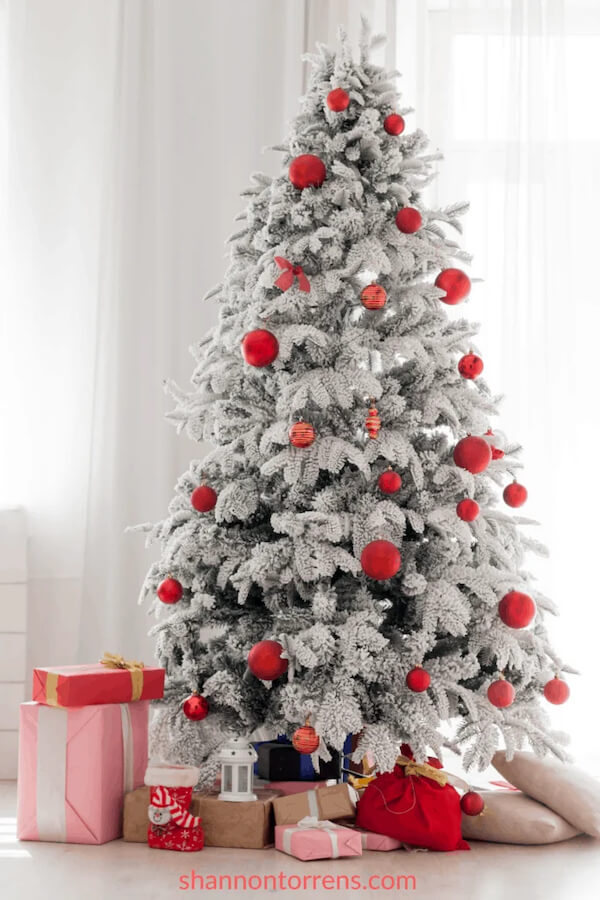 Flocked Christmas Tree with Red Ornaments