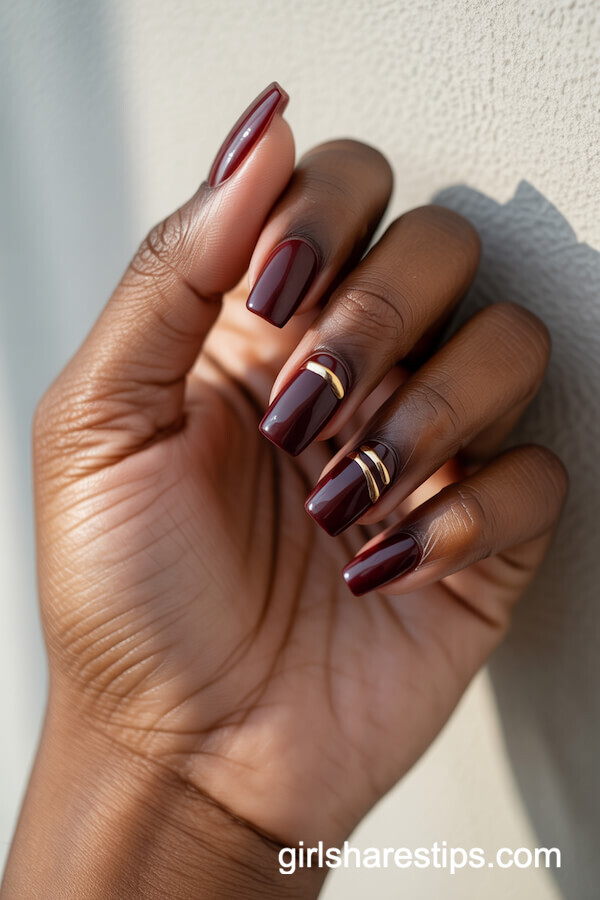 Deep Burgundy Coffin Nails with Gold Lines