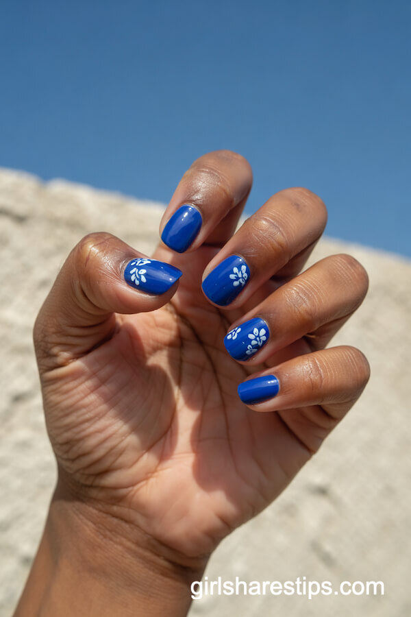 Royal Blue Nails with White Floral Accents