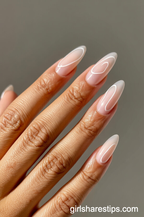 Stiletto Neutral Pink Nails with Abstract White Heart Line Art