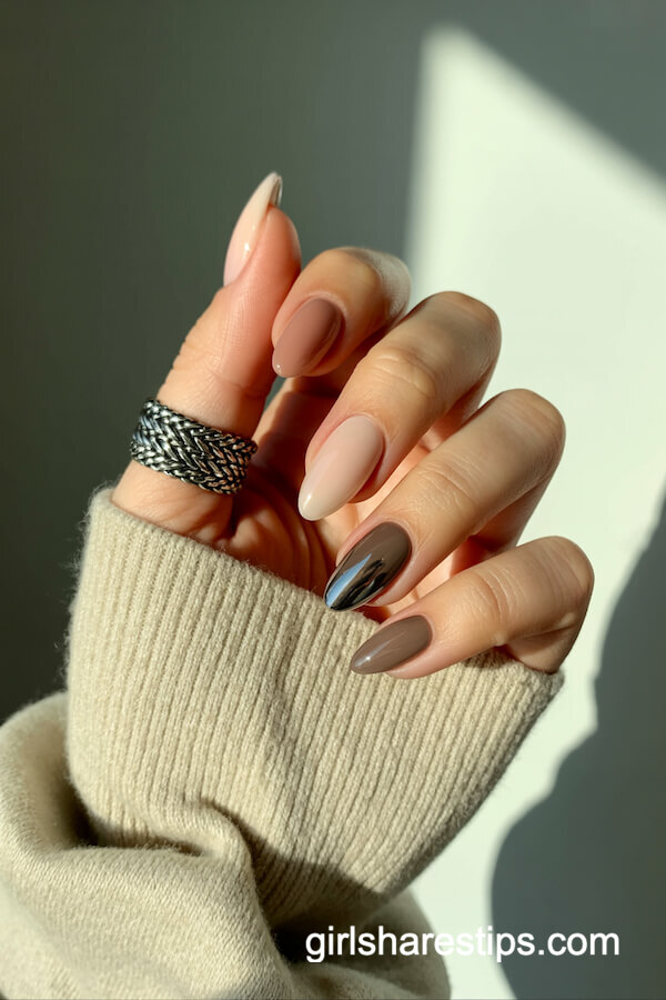 Ombré nude almond nails with chrome accents