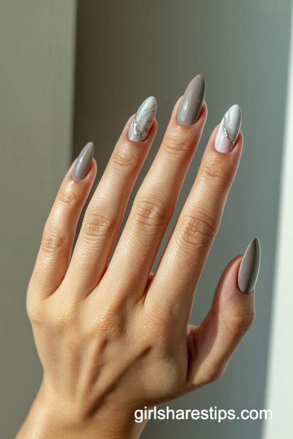 Greige stiletto nails with marble effect