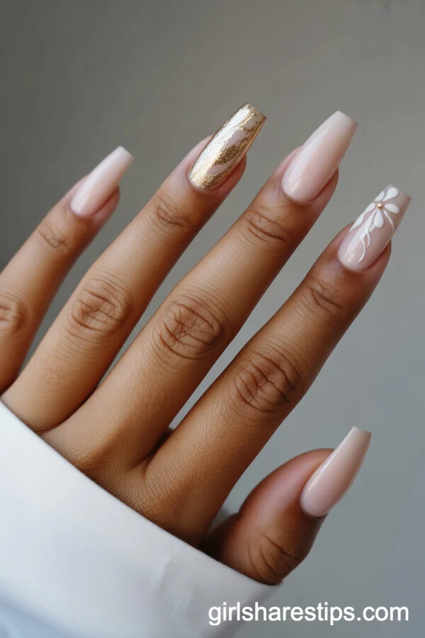 Coffin Nude Nails with Gold Foil and White Floral Accents