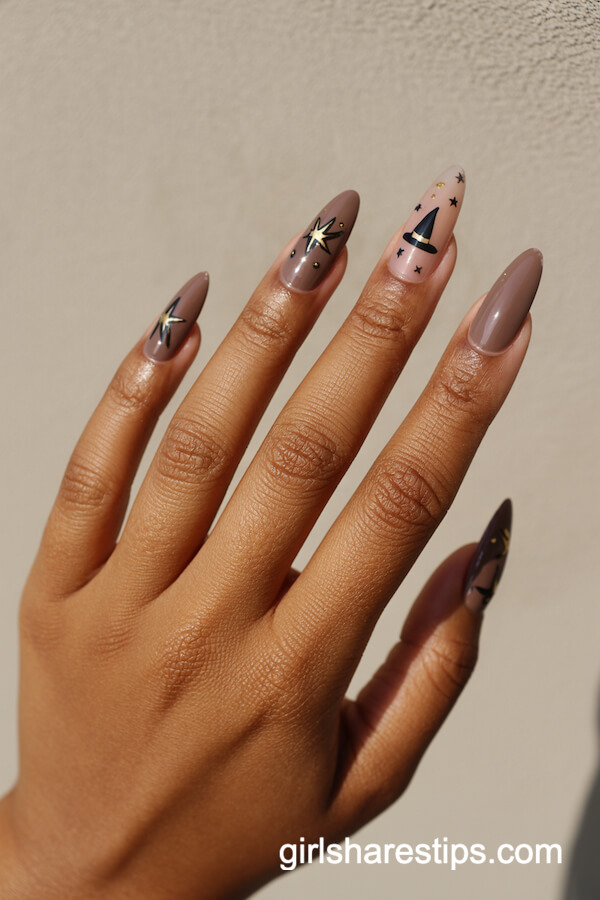 Mushroom taupe nails with black witch hats and gold stars