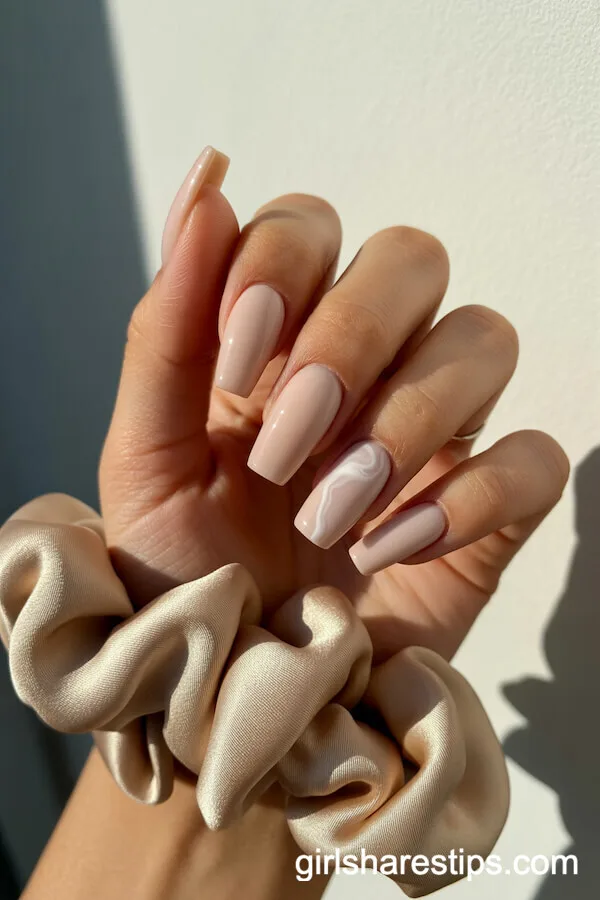 Vanilla Nude Coffin Nails with Elegant Marble Accent