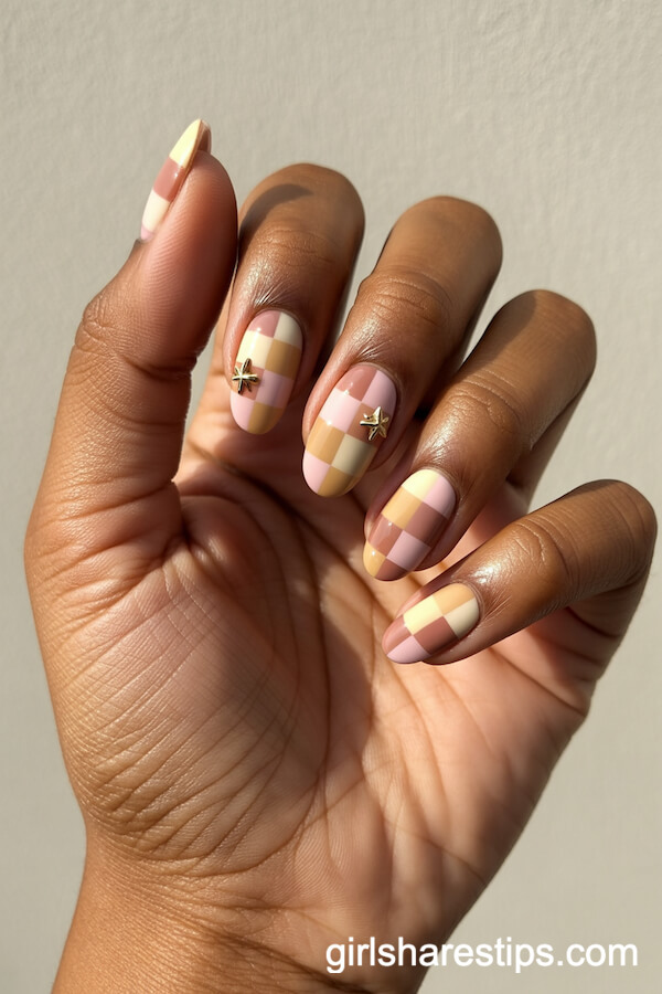 Neutral Checkerboard and Gold Star Accents on Oval Nails
