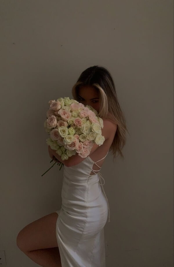 Hiding Behind a Bouquet of Roses
