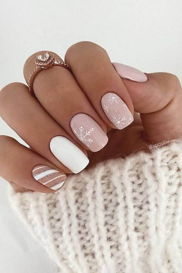 Nude Nails With White Snowflakes And Stripes