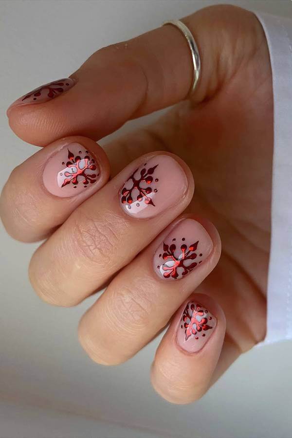 Nude Nails With Red And White Snowflakes