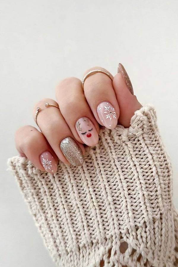 Nude Nails With Reindeer And Snowflakes