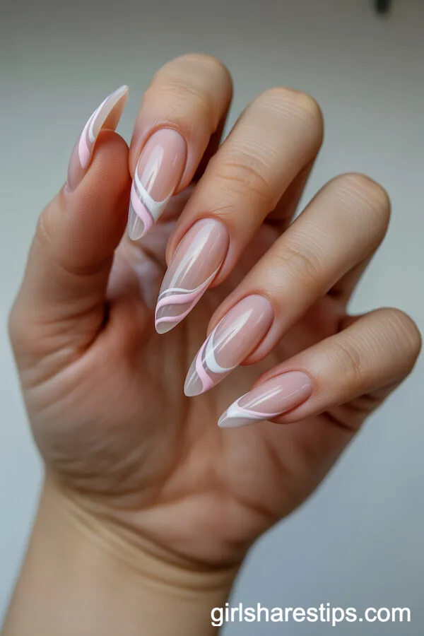 Long Stiletto Nude Nails with Abstract Pink and White Swirls