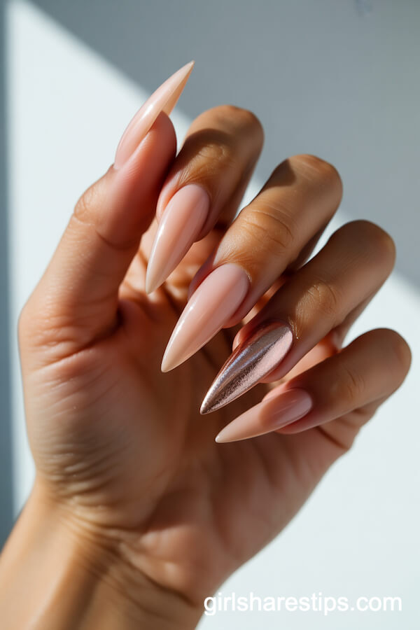 Long Nude Stiletto Nails with Rose Gold Foil Accents