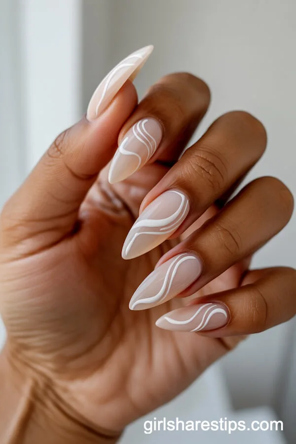 Stiletto Nude Nails with Minimalist Abstract Swirls