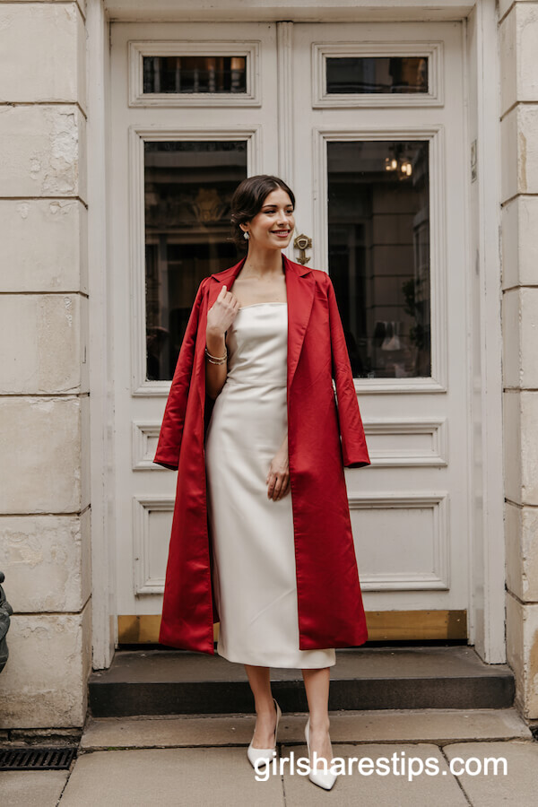 Red Overcoat Draped Over Ivory Midi Dress
